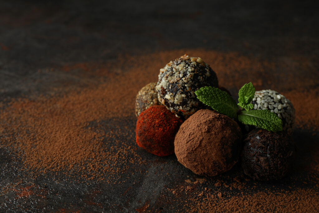 Concept of sweets with truffles on dark textured background