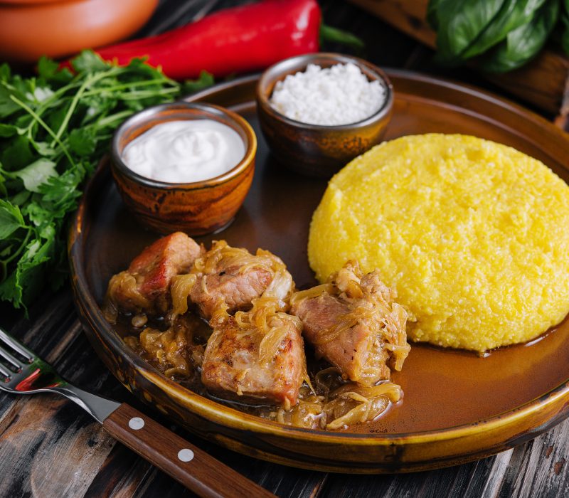 Traditional Moldavian, Romanian cornmeal porridge with meat and sauce